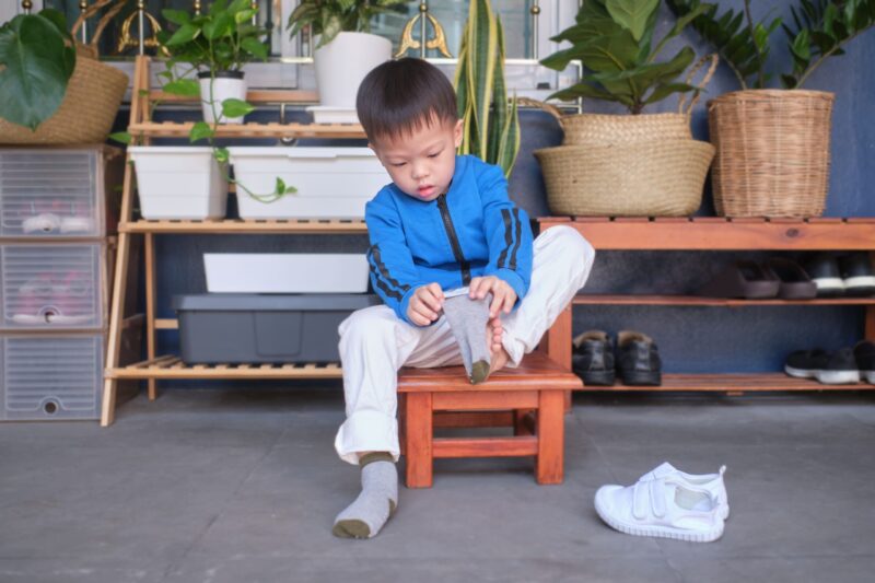 Why is my Child Struggling to put on their Shoes & Socks?